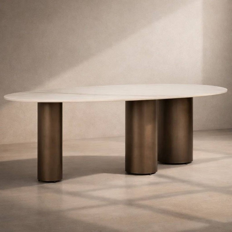 Mesa alina ovalada cerámica con patas cilíndricas en bronce cepillado 220x110x76cm