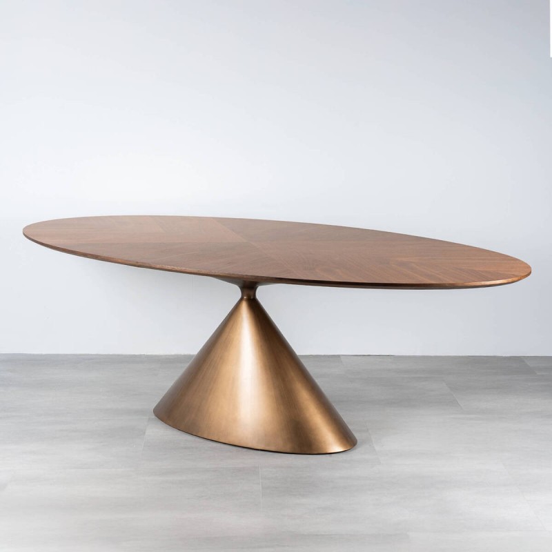 Mesa de comedor  Atria ovalada en nogal con base metálica bronce