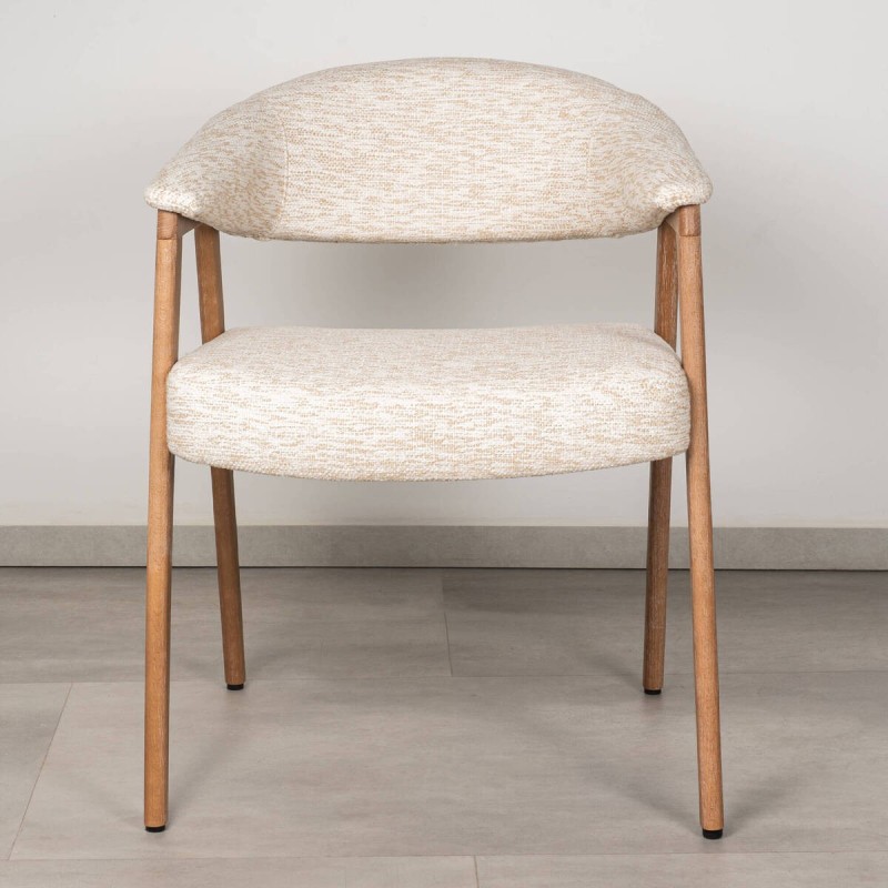 Noor dining chair upholstered in beige fabric with bleached wood frame