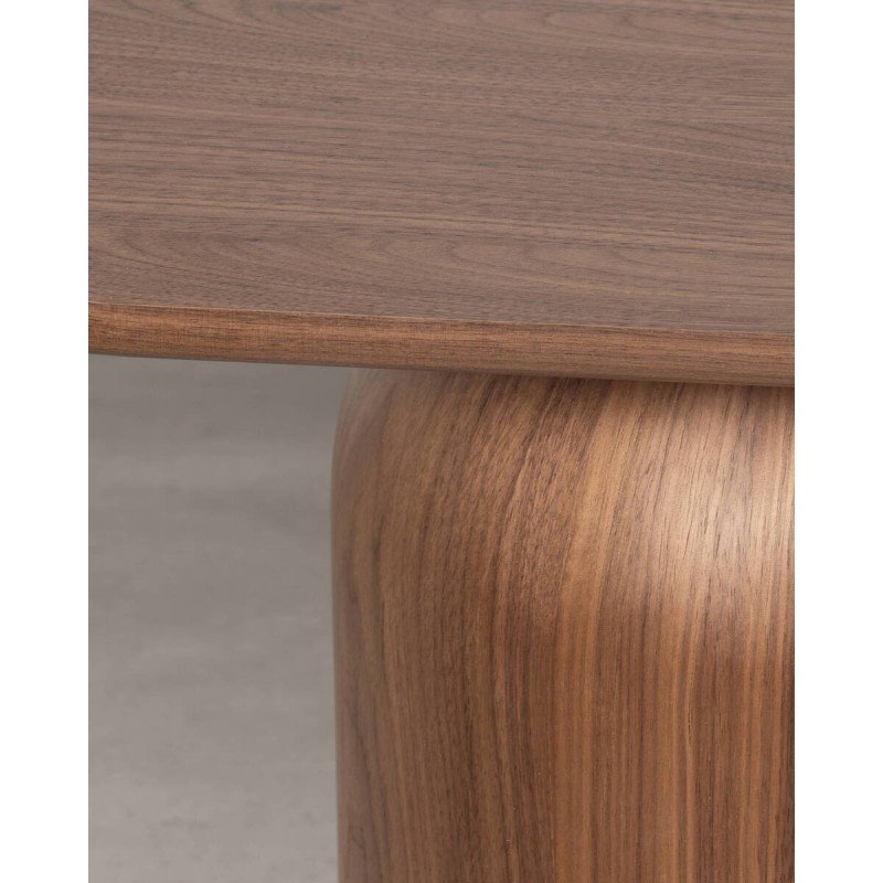 Vana side table in walnut with rounded base and oval top