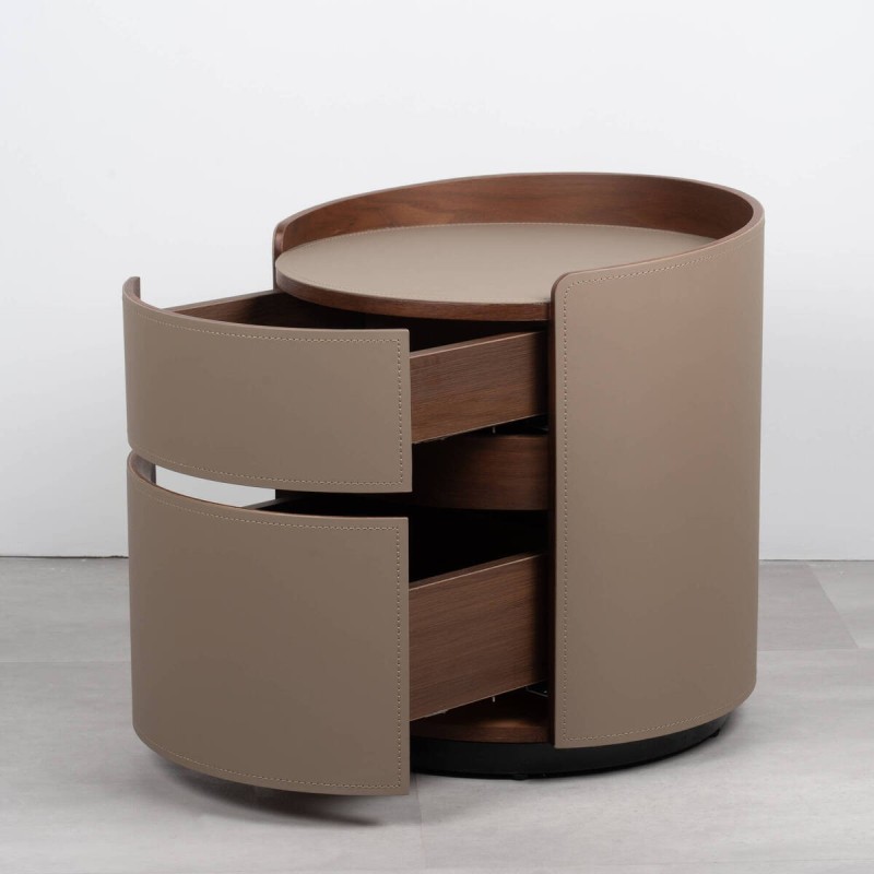 Round Silk bedside table upholstered in leather with two drawers