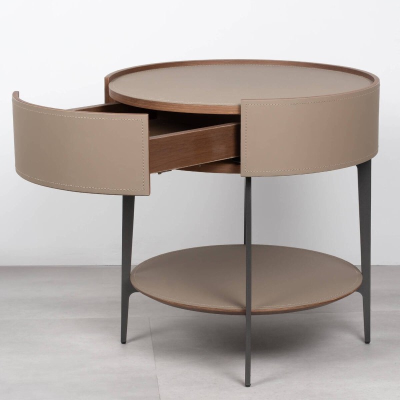 Velia round bedside table upholstered in leather with metal legs
