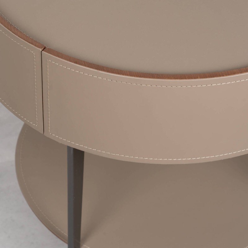 Velia round bedside table upholstered in leather with metal legs