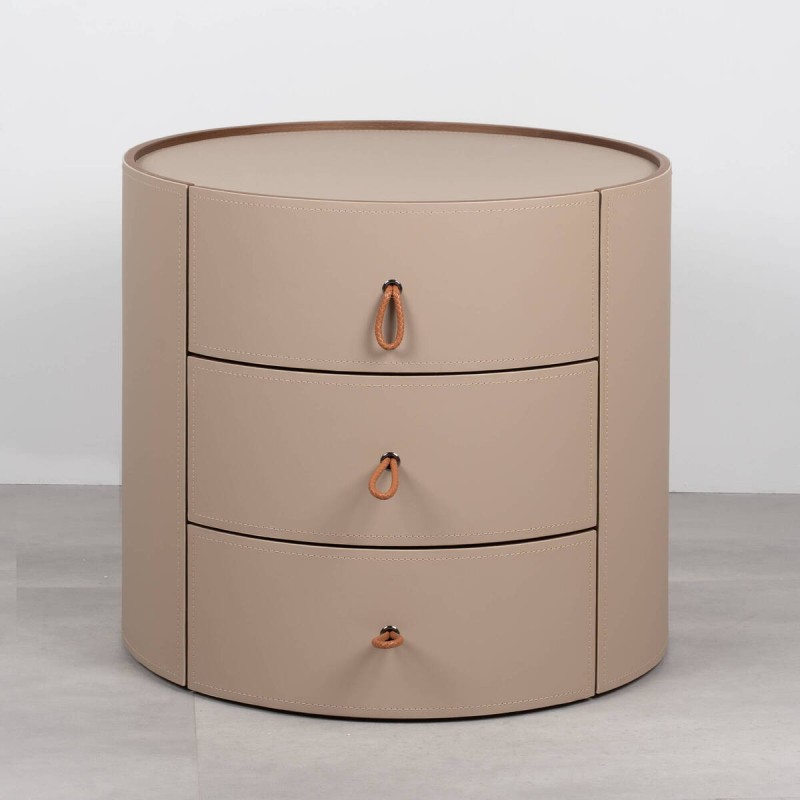 Velien round bedside table upholstered in leather with three drawers
