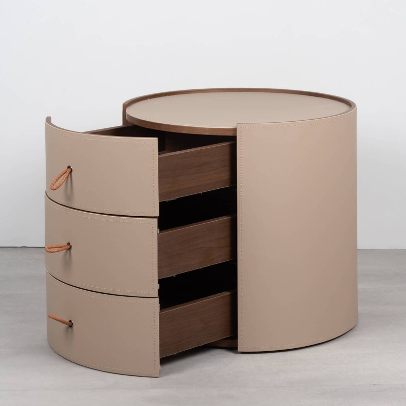 Velien round bedside table upholstered in leather with three drawers