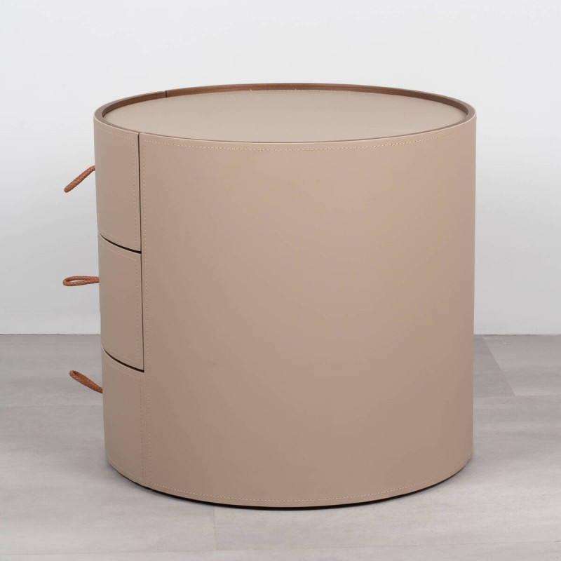 Velien round bedside table upholstered in leather with three drawers