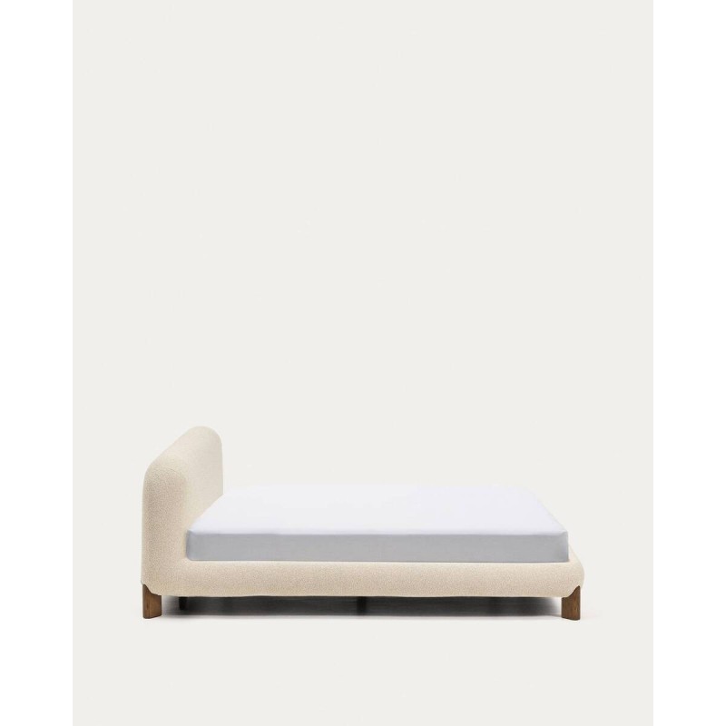 Odina bed with removable cover, raw bouclé fabric and solid ash wood legs with a walnut finish for a 160 x 200 cm mattress.