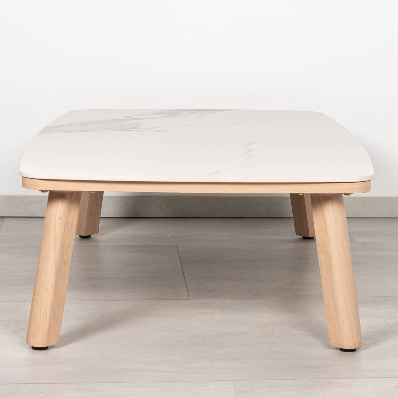 Rail outdoor coffee table with a marble-effect sintered stone top and wooden legs.